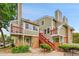 Multi-level townhouse featuring brick accents, red staircases and private balconies at 922 S Dearborn Way # 8, Aurora, CO 80012