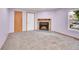 Inviting living room featuring a stone fireplace, plush carpeting, and natural light at 922 S Dearborn Way # 8, Aurora, CO 80012
