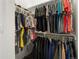 Well-organized walk-in closet with ample storage for clothes and accessories at 5681 Water Avens Dr, Castle Rock, CO 80104
