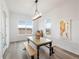 Bright dining room with modern table and bench seating with a view at 5681 Water Avens Dr, Castle Rock, CO 80104