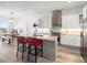 Modern kitchen featuring stainless steel appliances, granite countertops, and stylish bar seating at 5681 Water Avens Dr, Castle Rock, CO 80104