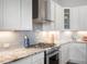 Gourmet kitchen featuring stainless steel appliances and granite countertops at 5681 Water Avens Dr, Castle Rock, CO 80104