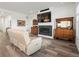 Bright living room with hardwood floors, fireplace and antique furniture at 5681 Water Avens Dr, Castle Rock, CO 80104
