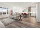 Open floor plan featuring living room, kitchen with island, and hardwood floors at 5681 Water Avens Dr, Castle Rock, CO 80104