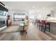 Open-concept living area with fireplace, ample natural light, and modern finishes at 5681 Water Avens Dr, Castle Rock, CO 80104
