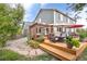 Backyard featuring a spacious wooden deck with pergola and an outdoor grill at 5686 Brook Hollow Dr, Broomfield, CO 80020