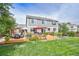 Lush backyard with a spacious wooden deck, perfect for outdoor entertaining at 5686 Brook Hollow Dr, Broomfield, CO 80020