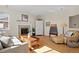 Inviting living room boasting hardwood floors, a fireplace, and ample natural light, perfect for relaxation at 5686 Brook Hollow Dr, Broomfield, CO 80020