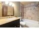 Cozy bathroom featuring tile shower and granite vanity at 1765 S Kline Way, Lakewood, CO 80232