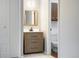 Stylish bathroom vanity with modern fixtures, a mirror, and easy access to a toilet providing convenience at 1765 S Kline Way, Lakewood, CO 80232