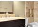 Bathroom featuring a granite vanity and tile shower at 1765 S Kline Way, Lakewood, CO 80232