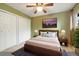 This bedroom has a large bed, neutral colors and large closets at 1765 S Kline Way, Lakewood, CO 80232