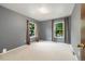 The bedroom features neutral walls, large windows, and ample natural light at 1765 S Kline Way, Lakewood, CO 80232