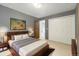 Bedroom with modern decor featuring a gray accent wall, art, and a cozy bed at 1765 S Kline Way, Lakewood, CO 80232