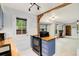 Charming kitchen with blue cabinets, butcher block countertops, and an open view to the living room at 1765 S Kline Way, Lakewood, CO 80232