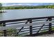 Scenic lake view from bridge, featuring lush greenery and distant mountains at 1765 S Kline Way, Lakewood, CO 80232
