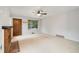 Bright living room with fireplace, natural light and neutral color palette at 1765 S Kline Way, Lakewood, CO 80232