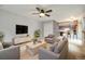 Spacious and stylish living room with fireplace, ample seating, and modern decor at 1765 S Kline Way, Lakewood, CO 80232
