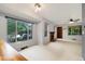 Spacious living room with large windows and a cozy fireplace at 1765 S Kline Way, Lakewood, CO 80232