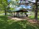 Inviting lakeside picnic area with covered pavilion, tables, and scenic views for outdoor gatherings at 1765 S Kline Way, Lakewood, CO 80232