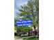 Scenic view of the lake framed by lush trees offering a serene and picturesque setting at 1765 S Kline Way, Lakewood, CO 80232