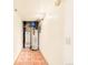 A glimpse of the basement featuring HVAC equipment, and terracotta tile floors at 8777 W Cornell Ave # 2, Lakewood, CO 80227