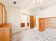 Bright bedroom showcasing wood furnishings with ensuite bathroom and closet access at 8777 W Cornell Ave # 2, Lakewood, CO 80227