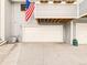 This spacious two-car garage offers ample parking and storage, with an American flag flying nearby at 8777 W Cornell Ave # 2, Lakewood, CO 80227