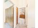 Hallway with multiple closet doors, offering ample storage and leading to other rooms at 8777 W Cornell Ave # 2, Lakewood, CO 80227