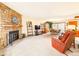 Inviting living room featuring a stone fireplace, plush carpeting, and a comfortable layout for relaxation at 8777 W Cornell Ave # 2, Lakewood, CO 80227