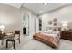 Basement bedroom with comfortable bed and adjacent bathroom at 6561 S Harlan Ct, Littleton, CO 80123