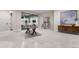 Finished basement game room with foosball table and seating at 6561 S Harlan Ct, Littleton, CO 80123