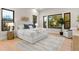 Spacious primary bedroom with large windows and wood floors at 6561 S Harlan Ct, Littleton, CO 80123