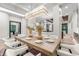 Formal dining room with large table, chandelier, and hardwood floors at 6561 S Harlan Ct, Littleton, CO 80123