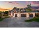 Stunning two-story home with stone accents and a three-car garage at 6561 S Harlan Ct, Littleton, CO 80123