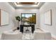 Bright home office features wood flooring, large window, and modern desk at 6561 S Harlan Ct, Littleton, CO 80123