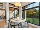 Bright kitchen breakfast nook with large windows and a view of the backyard at 6561 S Harlan Ct, Littleton, CO 80123
