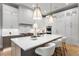 Modern kitchen with a large island and high-end stainless steel appliances at 6561 S Harlan Ct, Littleton, CO 80123