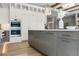 Modern kitchen with a large island and high-end stainless steel appliances at 6561 S Harlan Ct, Littleton, CO 80123