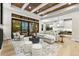 Open living space with hardwood floors, fireplace, and kitchen views at 6561 S Harlan Ct, Littleton, CO 80123