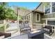 Back deck with a pergola, fire pit, and wicker seating provides an inviting outdoor living space at 11245 San Joaquin Rdg, Littleton, CO 80127