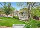 Green backyard with a deck, patio, and lawn at 11245 San Joaquin Rdg, Littleton, CO 80127