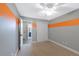 Neutral bedroom with carpet, an orange accent stripe, and a closet at 11245 San Joaquin Rdg, Littleton, CO 80127