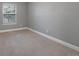 Neutral bedroom with carpet, a double-hung window, and white baseboards at 11245 San Joaquin Rdg, Littleton, CO 80127