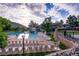 Stunning community pool with lounge chairs, slide and mountain views, great for recreation at 11245 San Joaquin Rdg, Littleton, CO 80127