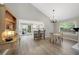 Bright dining area with hardwood floors, chandelier, and convenient kitchen access at 11245 San Joaquin Rdg, Littleton, CO 80127