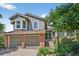 Charming two-story home featuring a well-manicured front yard, two car garage and brick accents at 11245 San Joaquin Rdg, Littleton, CO 80127