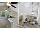 Open-concept living space with vaulted ceilings, fireplace, and large windows, offering ample natural light at 11245 San Joaquin Rdg, Littleton, CO 80127