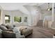 Bright living room with vaulted ceiling, hardwood floors, and large windows at 11245 San Joaquin Rdg, Littleton, CO 80127