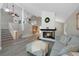 Spacious living room featuring fireplace, hardwood floors, and vaulted ceilings at 11245 San Joaquin Rdg, Littleton, CO 80127
